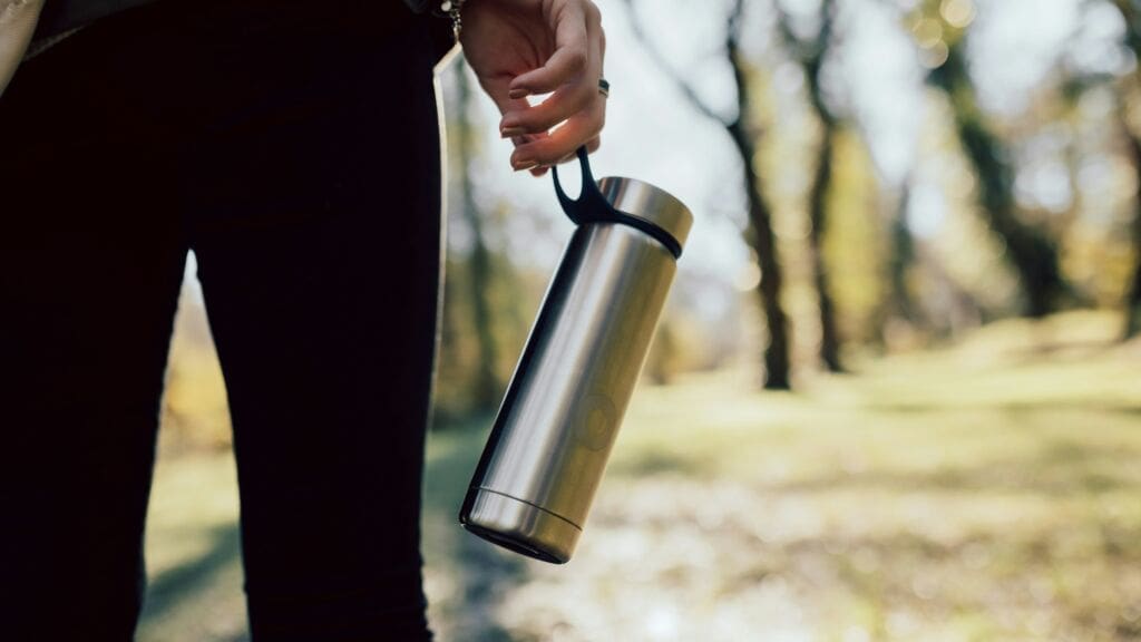 An image showing a reusable stainless steel water bottle as part of the Earth Hour initiative.
